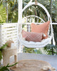 hanging chair outdoor room rust terracotta cushions jute rug